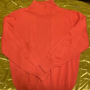 small red orange sweater